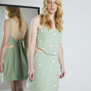 Bold top in green with decorated seashells