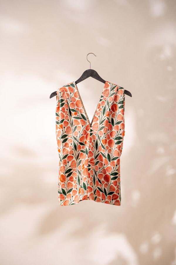 Feminine top with orange beads and patterned fabric