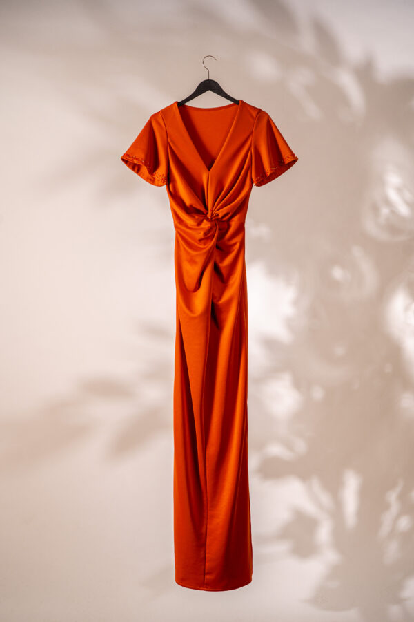 Long orange dress with pearls